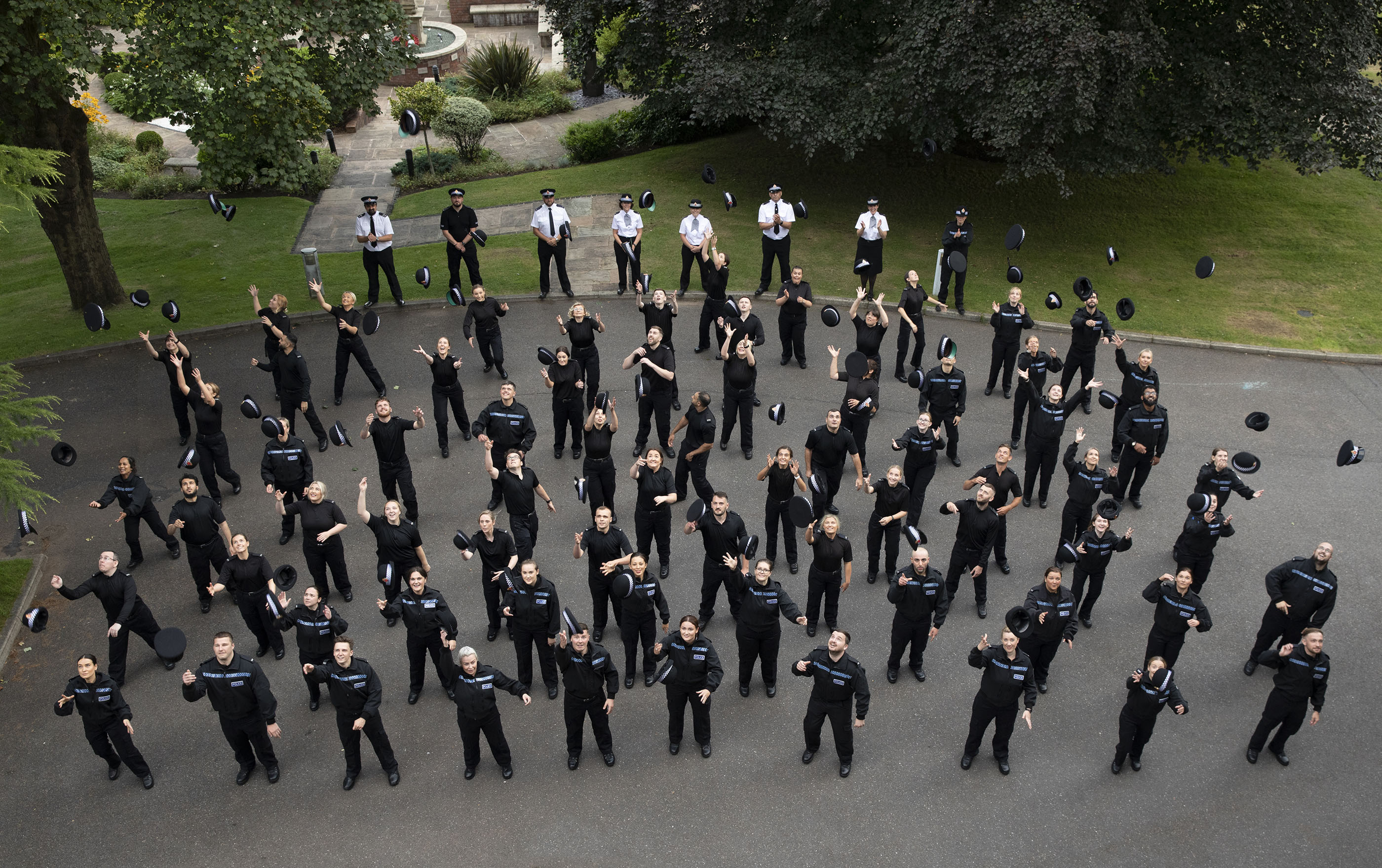 The new recruits celebrate completing their initial training