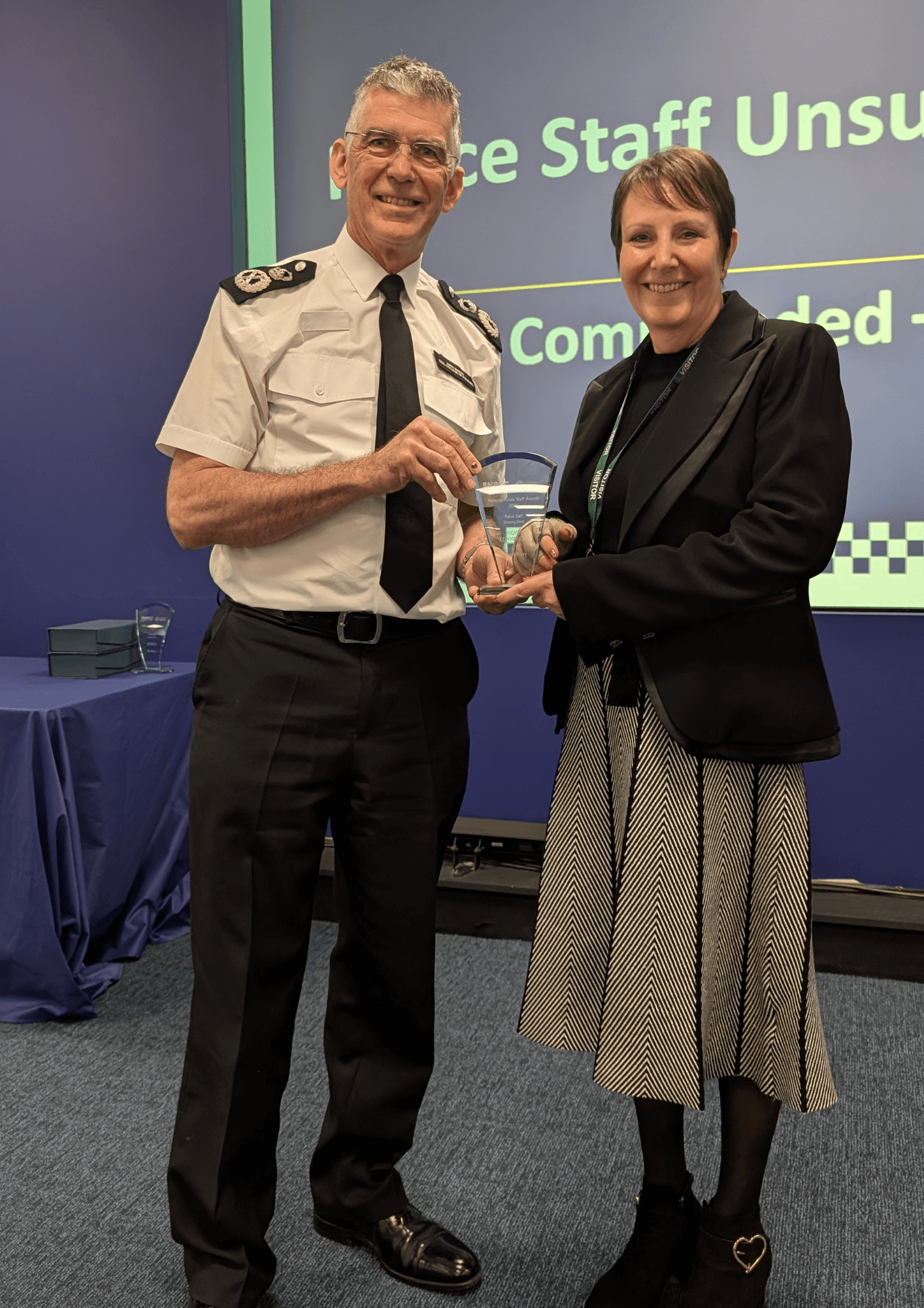 Hazel Parry receiving her award from Sir Andy Marsh, Chief Executive Officer of the College of Policing.