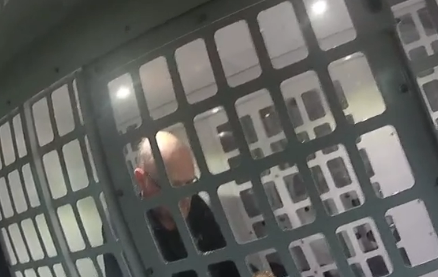 Martin arrested and in police van