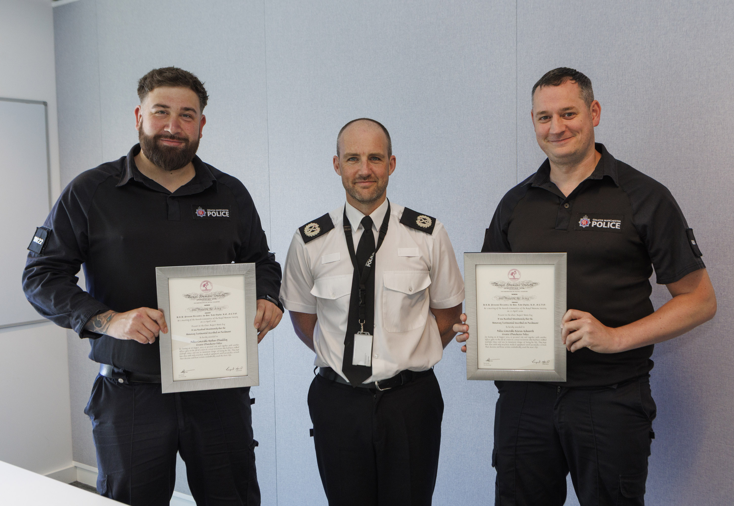 PC's Maudsley & Ashworth eitherside of ACC Meeney