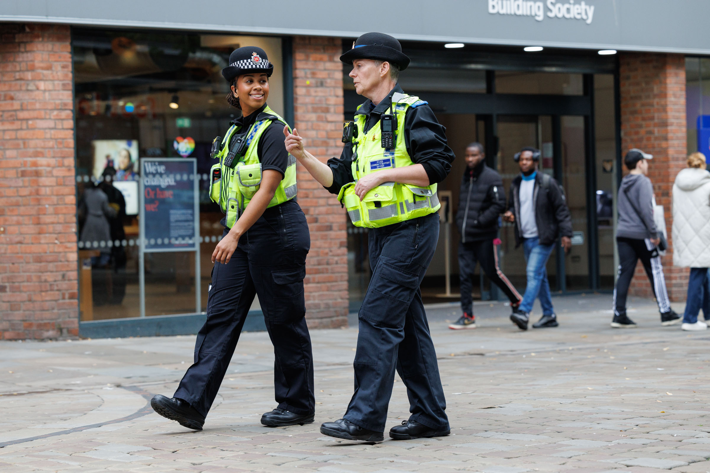 GMP officers walking along street