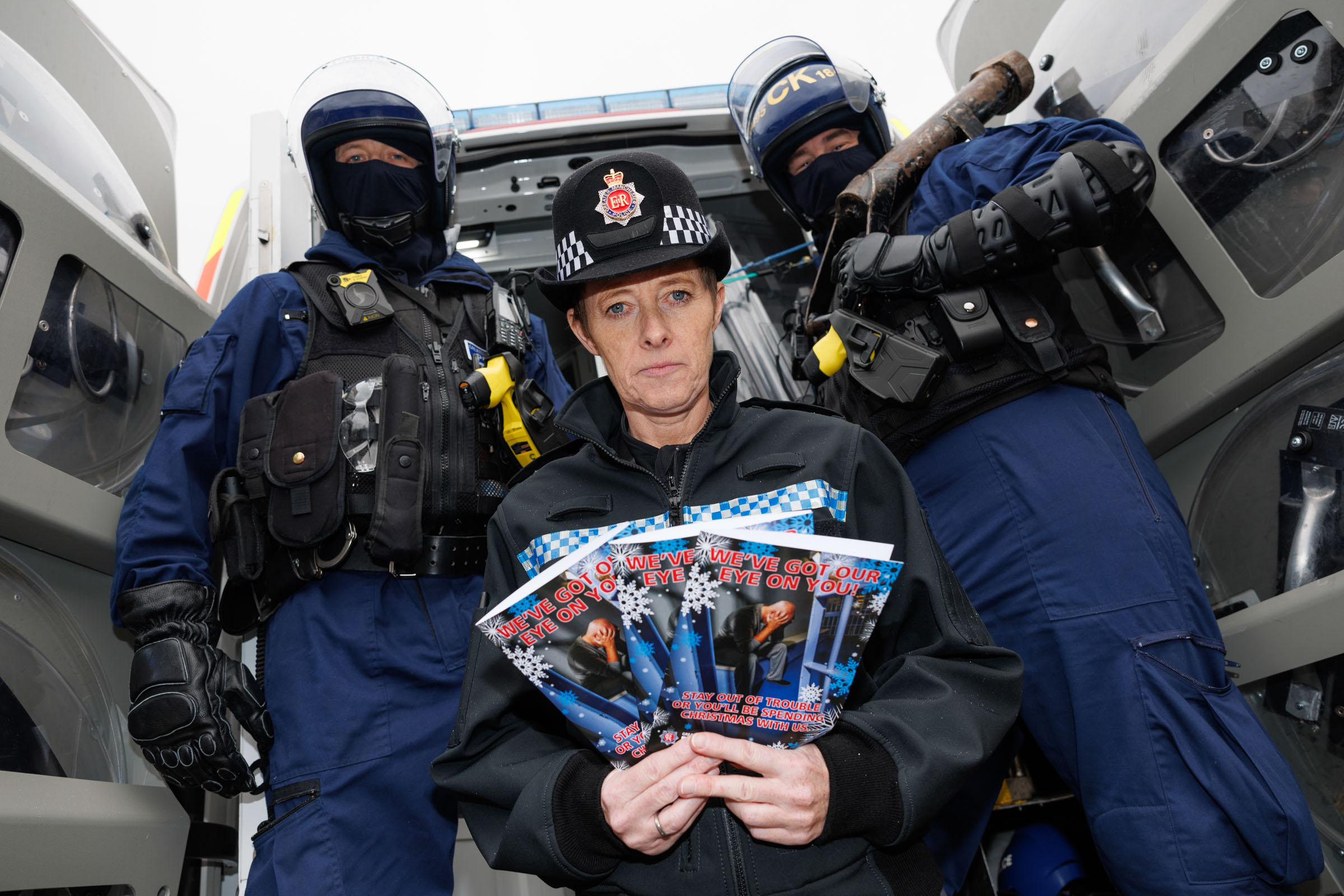 Inspector Lisa Clarke with GMP's most wanted Christmas cards