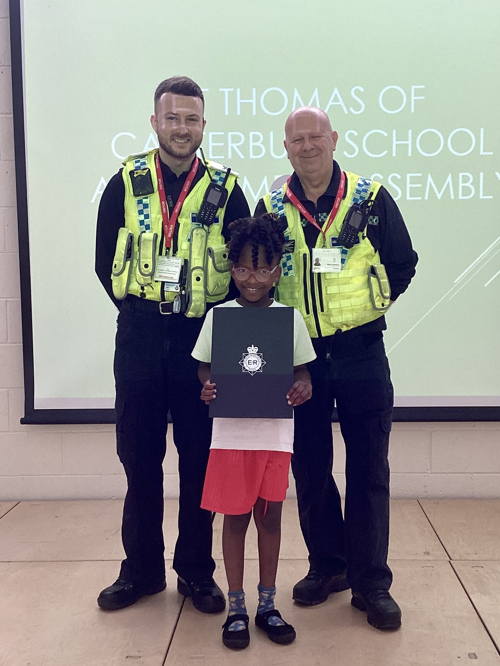 Monjola with Neighbourhood Sergeant Zach Keneally and PCSO Mark Flannery, from Bolton Prevention Hub