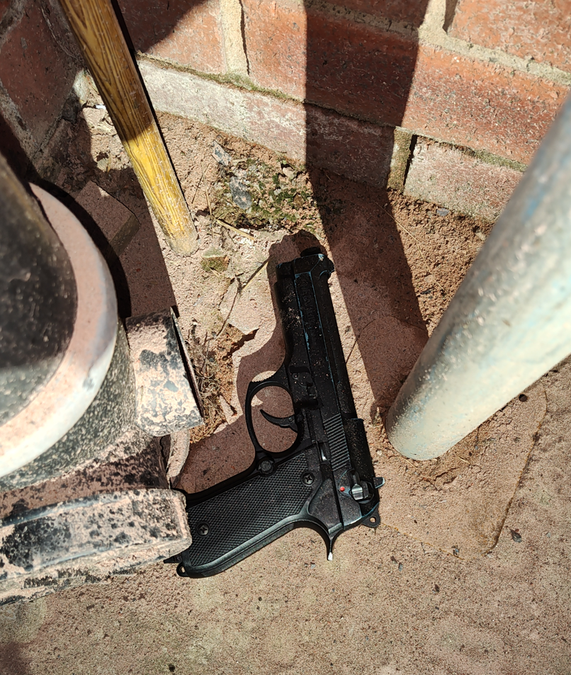 Image of recovered weapon at a property following a warrant.