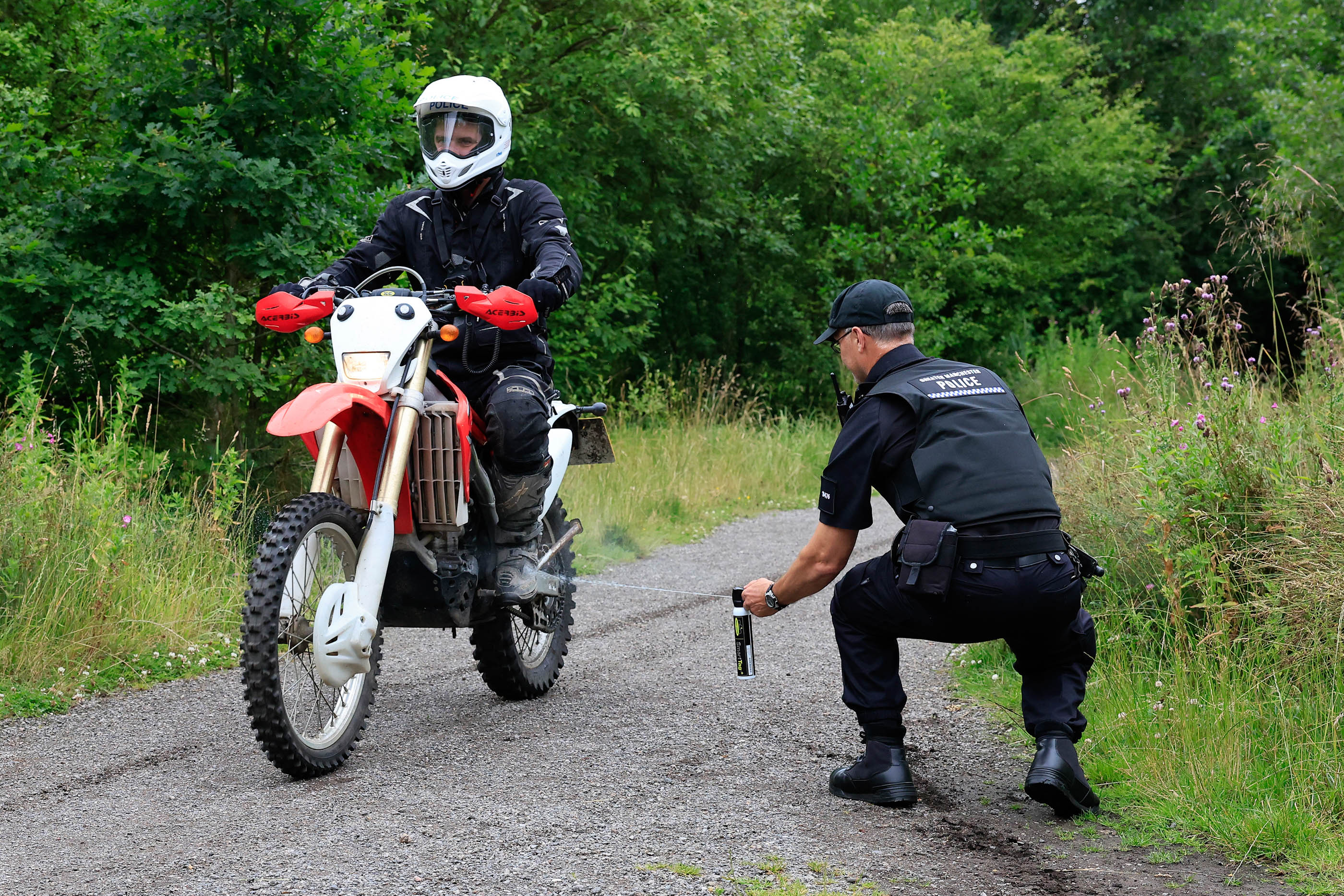 GMP officer sprays off-road bike with SmartTag solution.