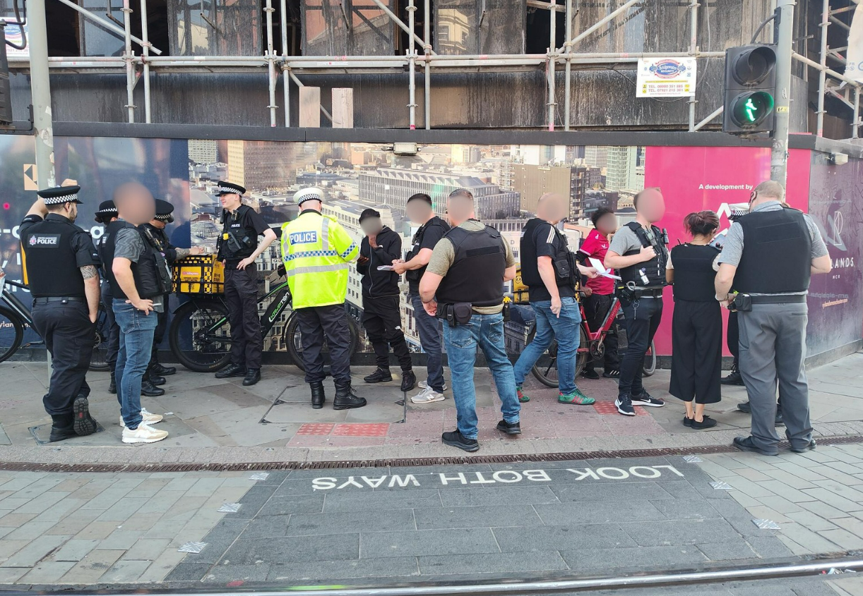 Officers engaging with e-bike riders in the city centre.