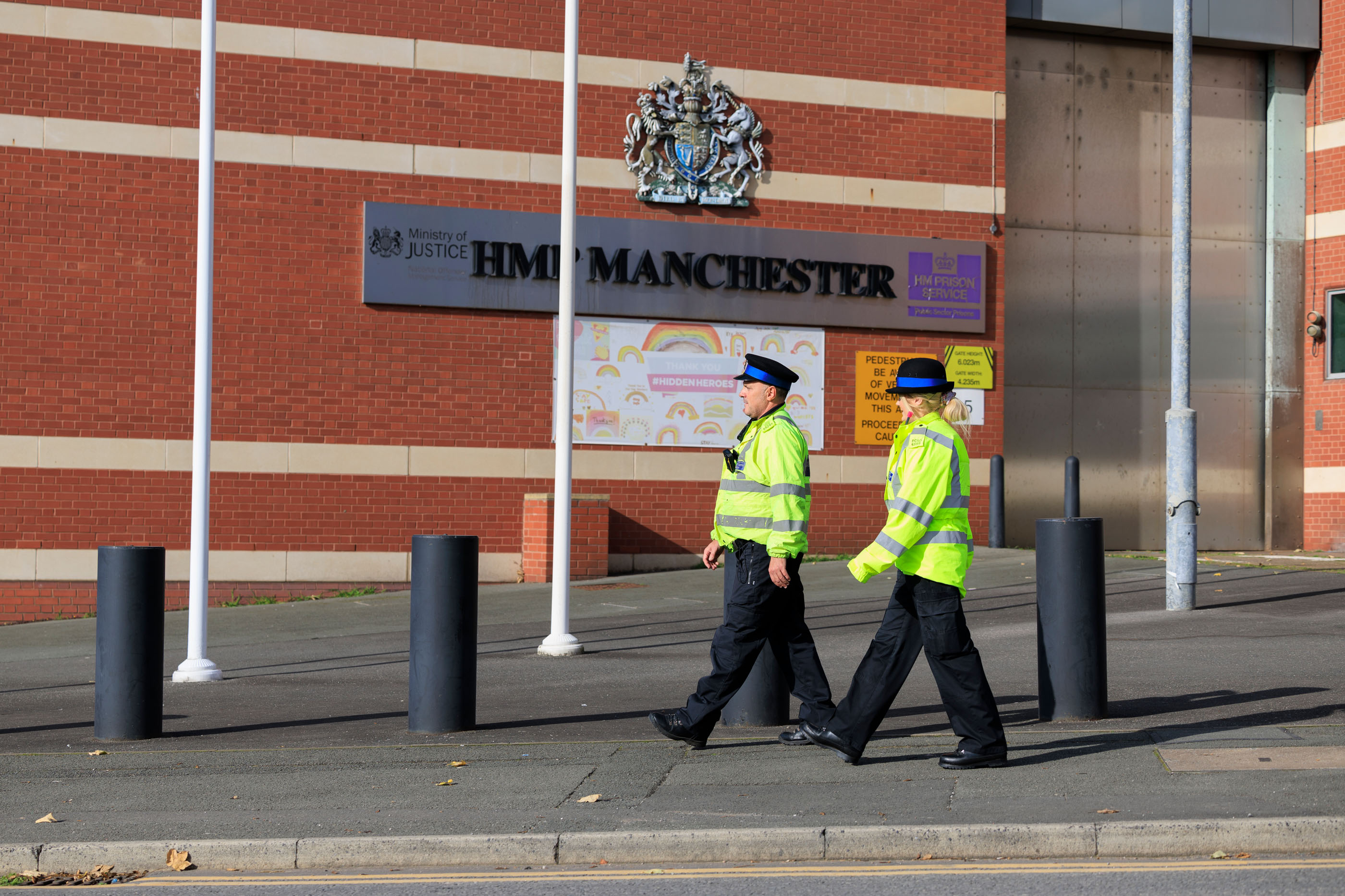 Officer patrolling outside HMP Manchester.