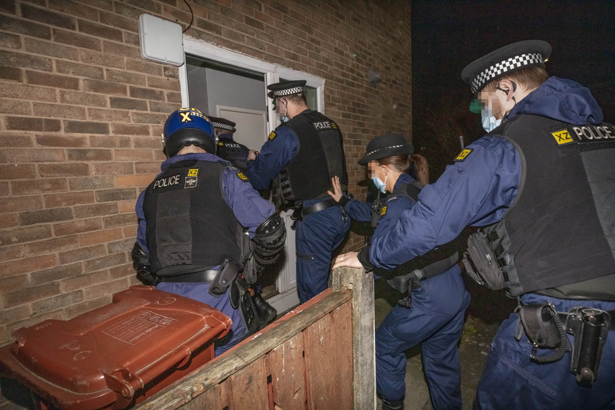 Drugs, cash and suspected firearm recovered during Manchester raids.