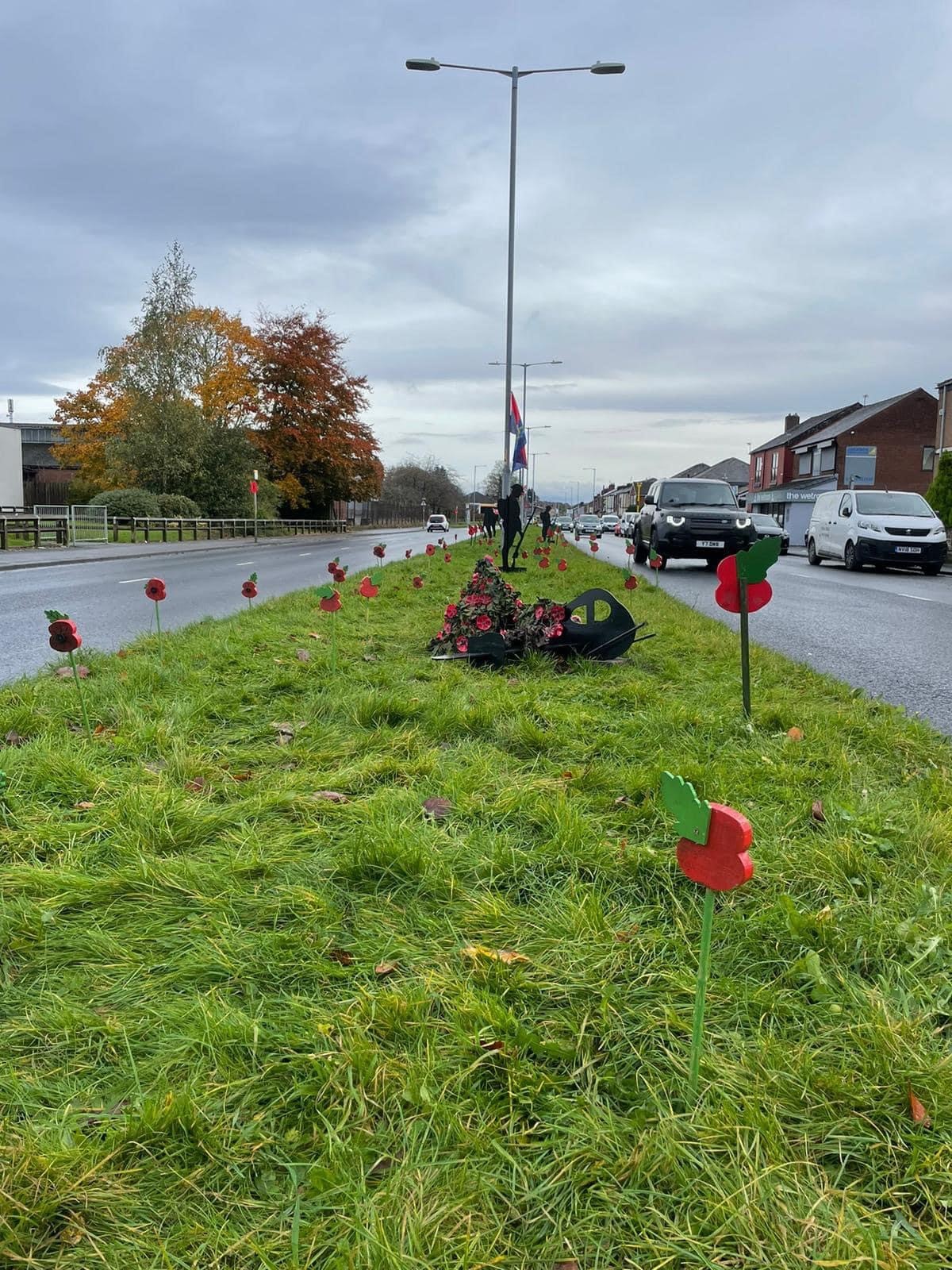 Image of soldiers and poppies on the central reservation of Bury Road in Breightmet, Bolton.