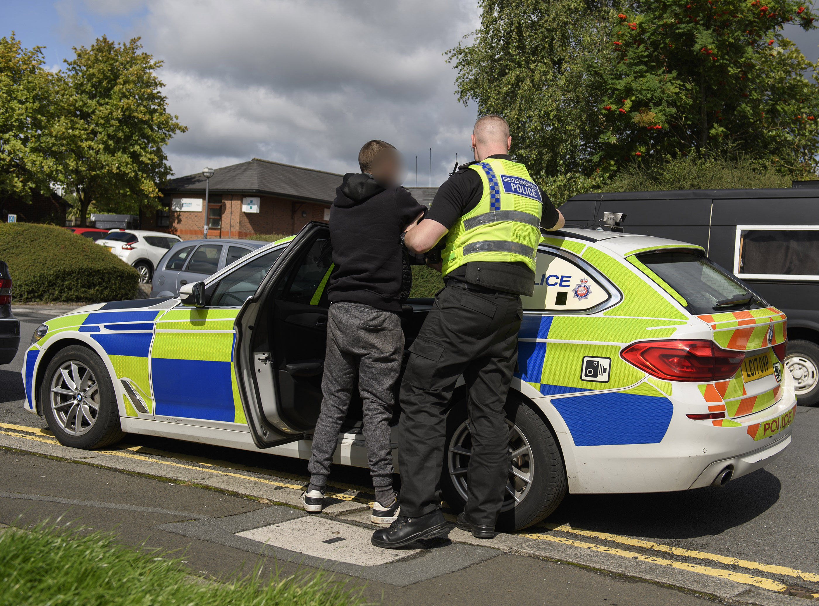 GMP officer arresting a suspect.